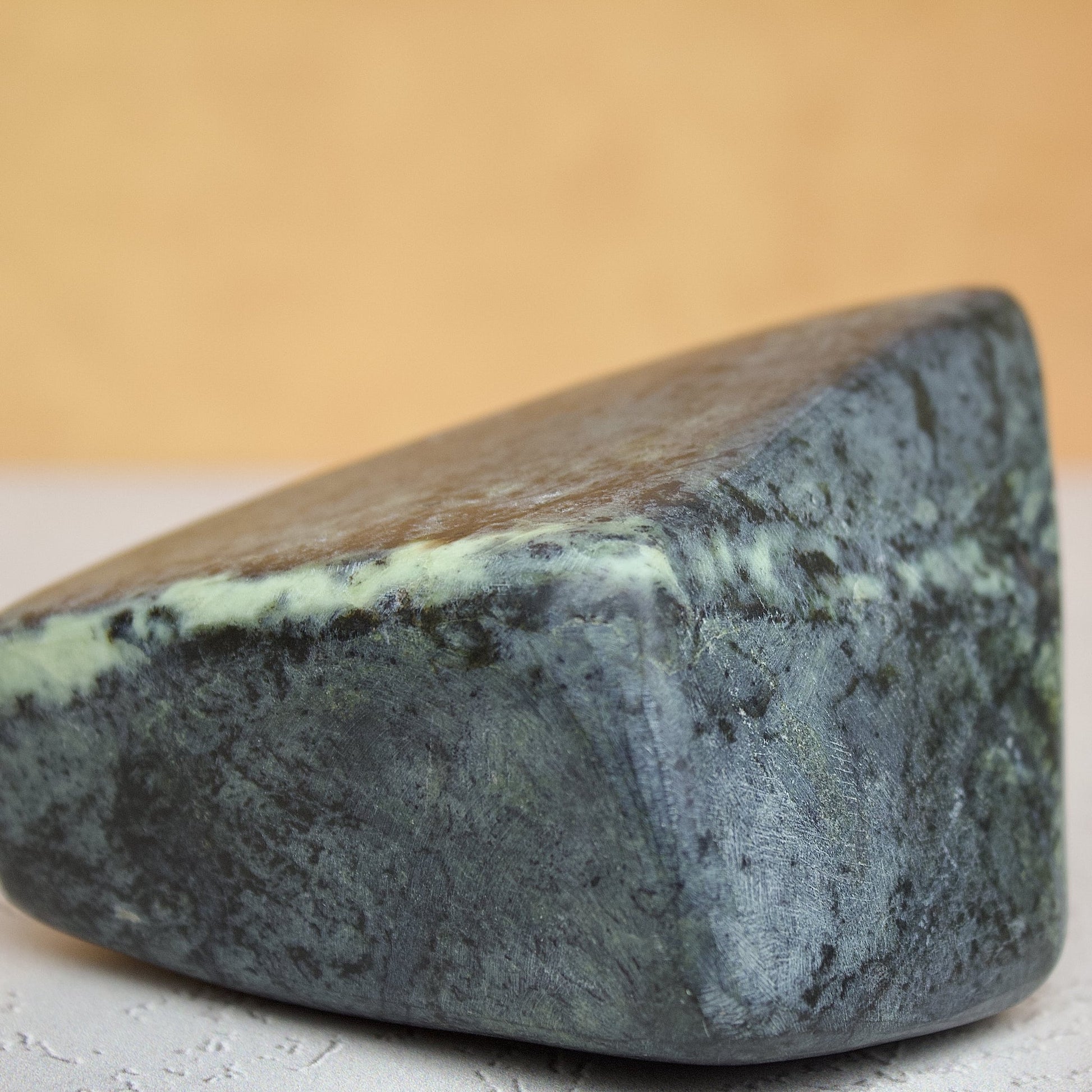 close up dark polished green leopard stone serpentine variety